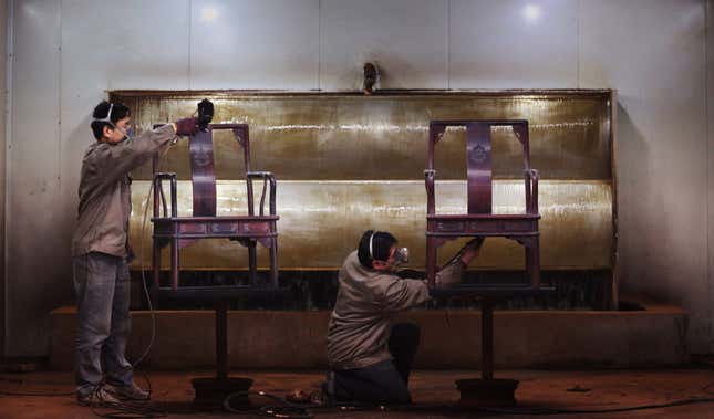 Furniture makers work with Mukula wood in Jinhua, in China’s eastern Zhejiang province.