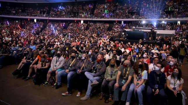 Fans attend a crowded panel at Star Wars Celebration 2022.