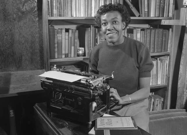 Gwendolyn Brooks (1917 - 2000) sitting at a typewriter at home in Chicago, 2nd May 1950.