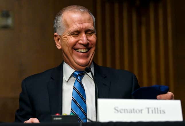 Senator Thom Tillis (R-NC) laughs during a Senate Environment and Public  Works Committee nomination hearing for Michael Stanley Regan to be  Administrator of the Environmental Protection Agency in Washington, DC,  on February 3, 2021.