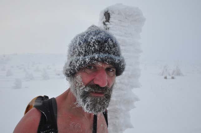Wim Hof, pioneer of environmental conditioning, hiking in the snow.