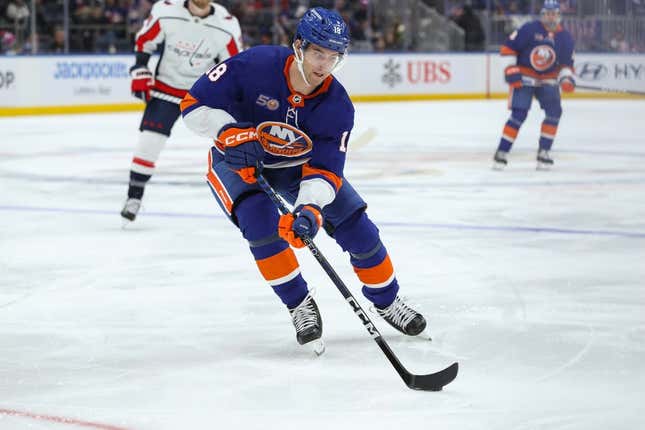 Mar 11, 2023; Elmont, New York, USA; New York Islanders left wing Pierre Engvall (18) skates with the puck against the Washington Capitals during the second period at UBS Arena.
