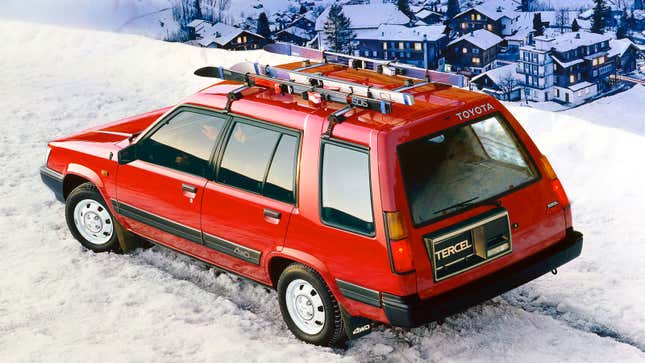 A red Toyota Tercel on a snowy mountain