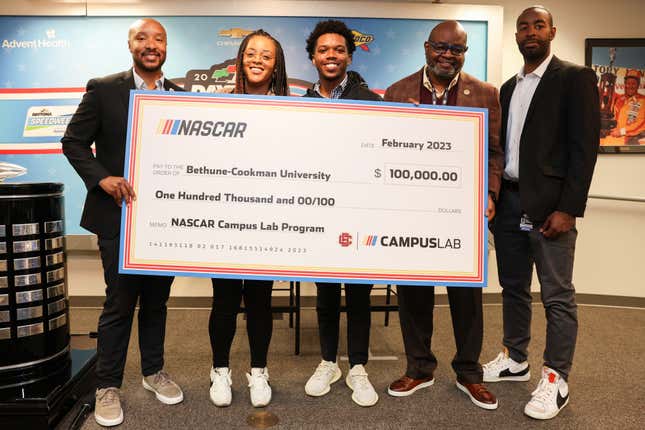 (L-R) John Ferguson Chief Human Resources Officer (CHRO) for NASCAR, Caryn Grant, Senior Manager of Diversity and Inclusion NASCAR, John Huger Jr., Dr. Lawrence Drake Interim President Bethune-Cookman University and Brandon Thompson Vice President, Diversity and Inclusion pose for a photo with a $100,000.00 check during a press conference prior to the NASCAR Cup Series 65th Annual Daytona 500 at Daytona International Speedway on February 19, 2023.