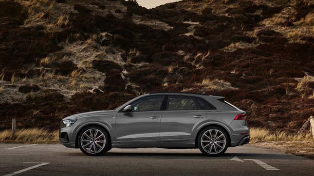 A grey Audi SUV with a raked rear end. 