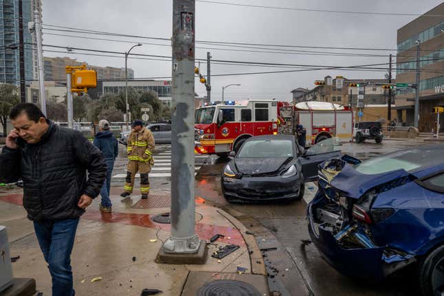First responders attend to a collision on February 01, 2023 in Austin, Texas. A winter storm is sweeping across portions of Texas, causing massive power outages and disruptions of highways and roads.