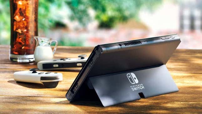 An outdoors shot showing off the Nintendo Switch (OLED Model)'s new ultra-wide kickstand. 