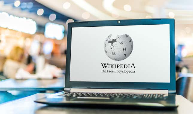 A laptop with the Wikipedia logo on it.