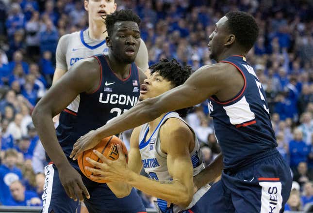 UConn’s Adama Sanogo (left) and Hassan Diarra (right) are two of the team’s three players who will need to contend with hunger as they face Miami in the Final Four.