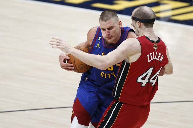 Jun 1, 2023; Denver, CO, USA; Denver Nuggets center Nikola Jokic (15) goes to the basket while defended by Miami Heat center Cody Zeller (44) during the second quarter in game one of the 2023 NBA Finals at Ball Arena.