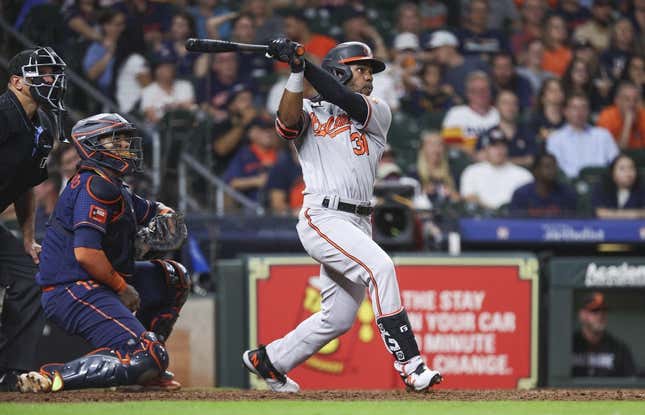 Sep 18, 2023; Houston, Texas, USA; Baltimore Orioles center fielder Cedric Mullins (31) hits a three-run home run during the ninth inning against the Houston Astros at Minute Maid Park.
