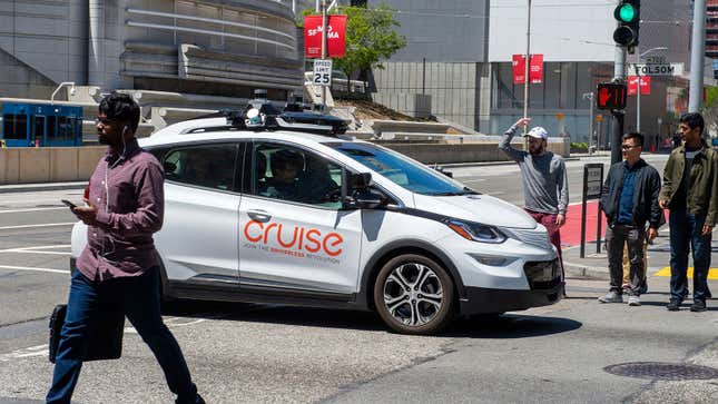 A self-propelled Cruise robotaxi causes displeasure among pedestrians after it got stuck at a crossroads on May 2, 2019 in San Francisco.