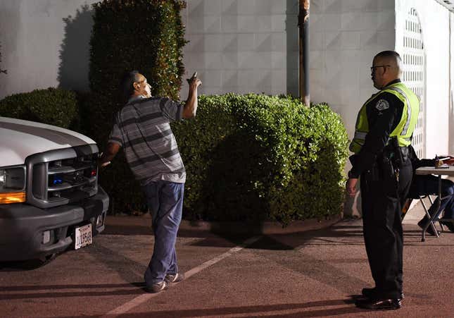 A man undergoes a sobriety test at a LAPD police DUI checkpoint in Reseda, Los Angeles, California on April 13, 2018.