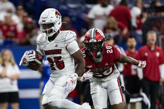 Sep 16, 2023; Indianapolis, Indiana, USA; Louisville Cardinals running back Jawhar Jordan (25) runs for a touchdown against Indiana Hoosiers defensive back Louis Moore (20) in the second quarter at Lucas Oil Stadium.