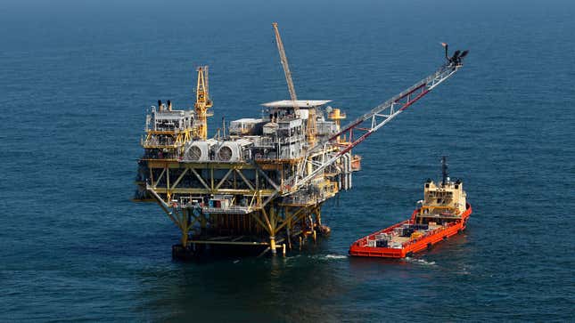 Photo of an oil rig and supply vessel in Gulf of Mexico