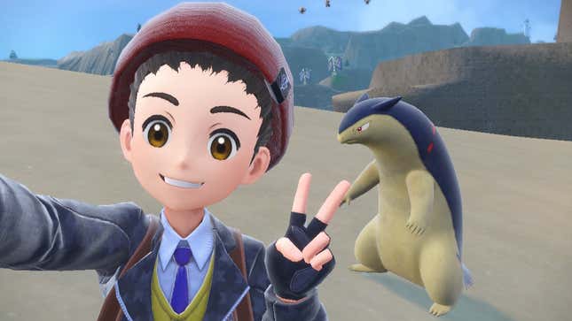 A trainer is seen taking a selfie with a Typhlosion