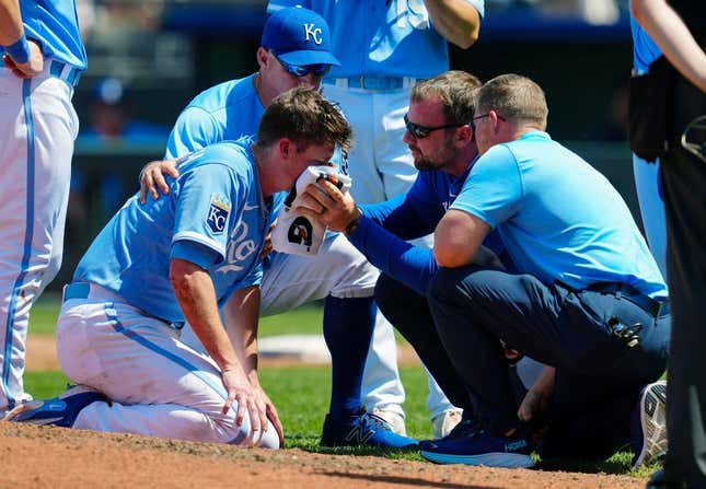 May 7, 2023; Kansas City, Missouri, USA; Kansas City Royals relief pitcher Ryan Yarbrough (48) is attended to by medical staff after being hit by a line drive off the bat of Oakland Athletics first baseman Ryan Noda (not pictured) during the sixth inning at Kauffman Stadium.