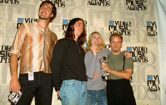 “Heavy Metal Parking Lot” enthusiasts and unidentified friend in 1993; photo via Getty