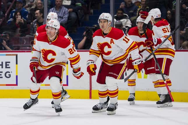 Mar 31, 2023; Vancouver, British Columbia, CAN; Calgary Flames forward Dillon Dube (29), defenseman Troy Stecher (51), defenseman Dennis Gilbert (48), forward Mikael Backlund (11) and forward Blake Coleman (20) celebrate Coleman&#39;s goal against the Vancouver Canucks in the second period at Rogers Arena.