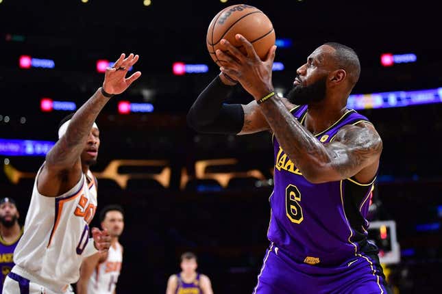 Apr 7, 2023; Los Angeles, California, USA; Los Angeles Lakers forward LeBron James (6) shoots against Phoenix Suns forward Torrey Craig (0) during the first half at Crypto.com Arena.