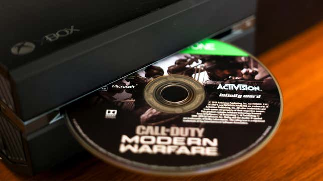 An Xbox One devours a Call of Duty disc.