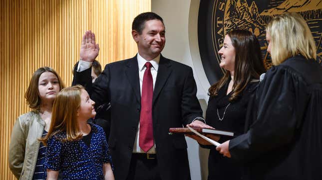 Montana Attorney General Austin Knudsen is sworn into office on Monday, Jan. 4, 2021, inside the Montana State Capitol in Helena, Mont.