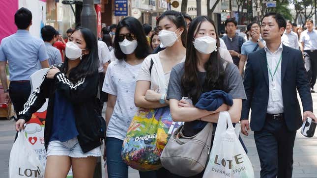 In Seoul, Chinese tourists wore masks as a precaution against MERS.