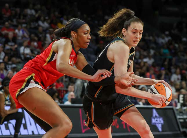 Breanna Stewart #30 of the New York Liberty drives against A’ja Wilson #22 of the Las Vegas Aces.