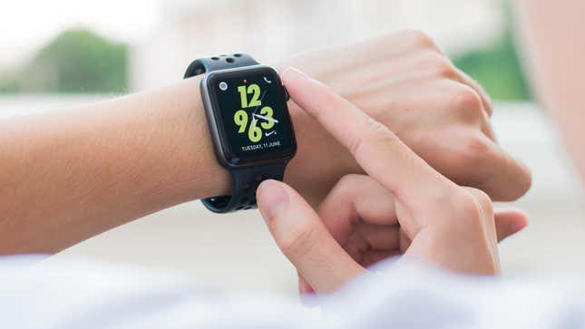 An Apple Watch on a wrist displaying the time