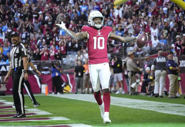 Arizona Cardinals wide receiver DeAndre Hopkins (10) celebrates after a touchdown catch against the Los Angeles Chargers during the first quarter at State Farm Stadium in Glendale on Nov. 27, 2022.