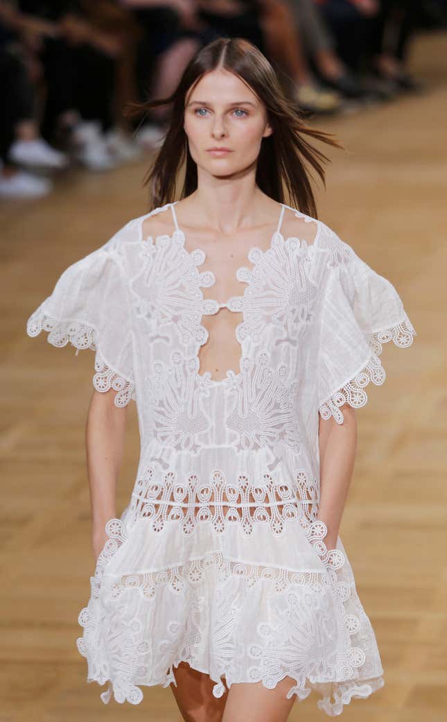 A model wears a creation as part of Chloe's Spring/Summer 2015 ready-to-wear fashion collection, presented in Paris, France, Sunday, Sept. 28, 2014.(AP Photo/Jacques Brinon)
