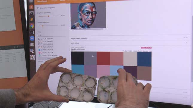 Peter Schaldenbrand, a Ph.D. student at Carnegie Mellon University’s School of Computer Science, holds two mixing trays in front of the color palette suggested by FRIDA