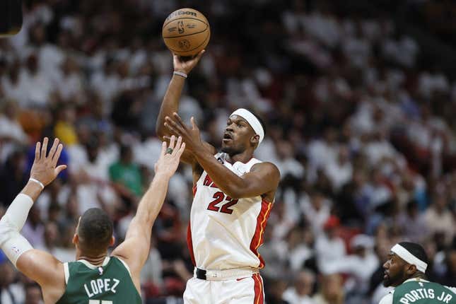 Apr 22, 2023; Miami, Florida, USA; Miami Heat forward Jimmy Butler (22) shoots the basketball over Milwaukee Bucks center Brook Lopez (11) in the first quarter during game three of the 2023 NBA Playoffs at Kaseya Center.