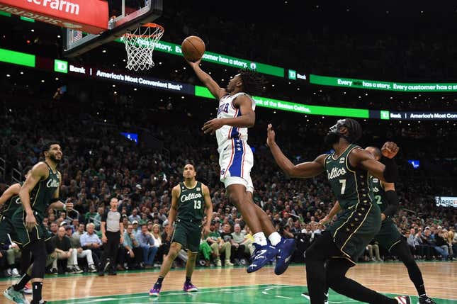 May 9, 2023; Boston, Massachusetts, USA; Philadelphia 76ers guard Tyrese Maxey (0) lays the ball in the basket past Boston Celtics guard Jaylen Brown (7) in the first half during game five of the 2023 NBA playoffs at TD Garden.