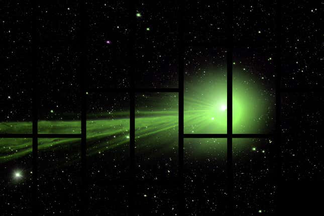 The Comet Lovejoy streaks from left to right, leaving a bright green trail.