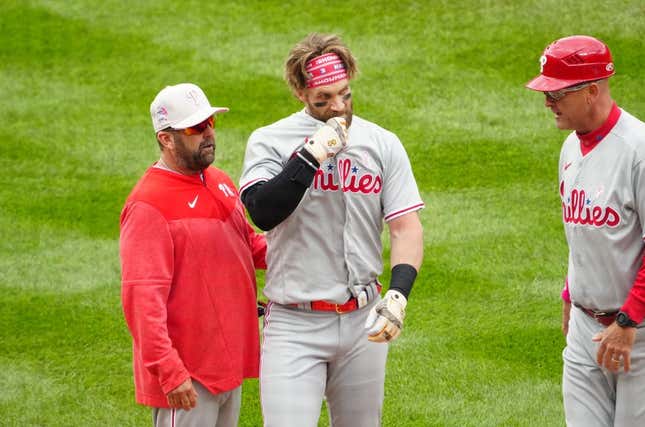 May 14, 2023; Denver, Colorado, USA; Philadelphia Phillies designated hitter Bryce Harper (3) following a scrum on the field in the seventh inning against the Colorado Rockies at Coors Field.