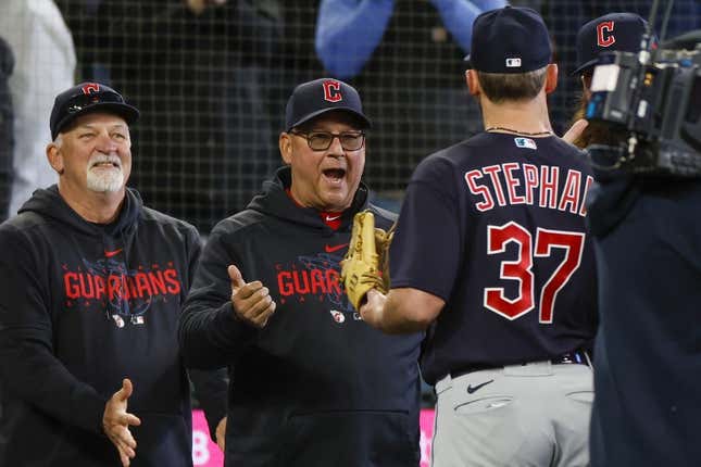 Apr 2, 2023; Seattle, Washington, USA; Cleveland Guardians hitting coach Chris Valaika (left) and manager Terry Francona (second from left) greet relief pitcher Trevor Stephan (37) following a 6-5 victory against the Seattle Mariners in ten innings at T-Mobile Park.