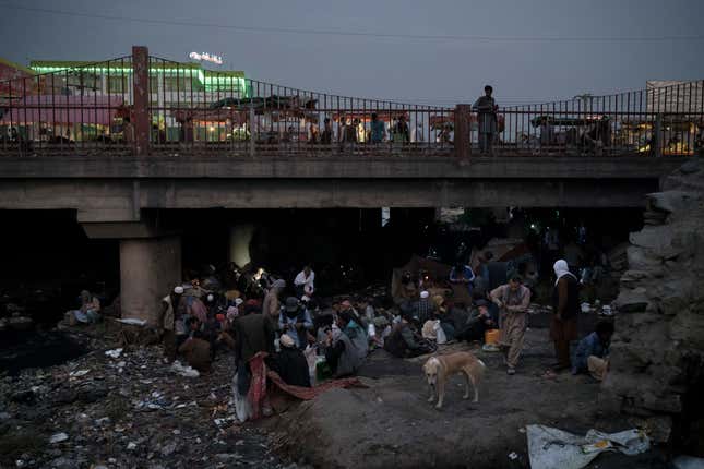 FILE - Afghans gather under a bridge to consume drugs, mostly heroin and methamphetamines in Kabul, Afghanistan, on Sept. 30, 2021. Afghanistan is the world’s fastest-growing maker of methamphetamine, a report from the United Nations drug agency said Sunday, Sept. 10, 2023. The country is also a major opium producer and heroin source, even though the Taliban declared a war on narcotics after they returned to power in August 2021.(AP Photo/Felipe Dana, File)