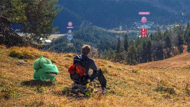 A promo image for Pokemon Go showing a trainer looking at gyms off in the distance. 