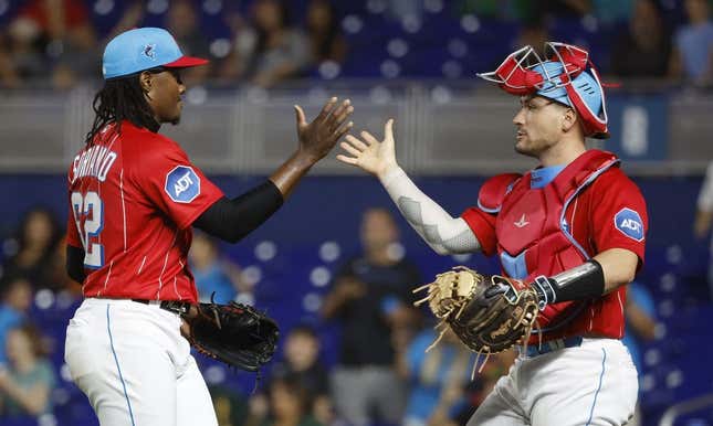 Jun 3, 2023; Miami, Florida, USA; Miami Marlins relief pitcher George Soriano (62) and catcher Nick Fortes (4) celebrate against the Oakland Athletics following the game at loanDepot Park.