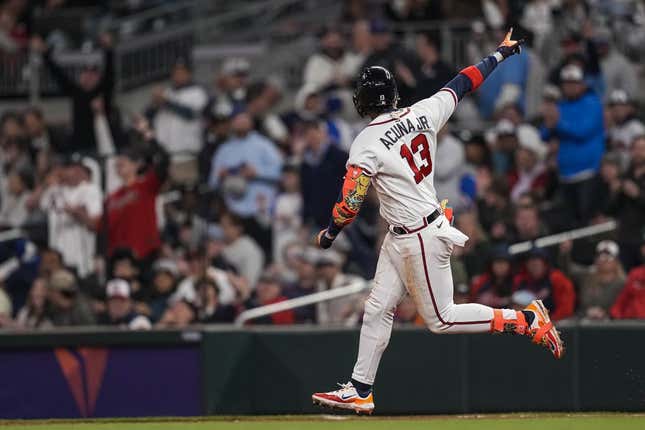 Apr 26, 2023; Cumberland, Georgia, USA;  Atlanta Braves right fielder Ronald Acuna Jr. (13) reacts after hitting a home run against the Miami Marlins during the sixth inning at Truist Park.
