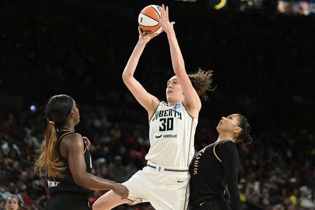 Aug 15, 2023; Las Vegas, Nevada, USA; New York Liberty forward Breanna Stewart (30) takes a shot against Las Vegas Aces guard Jackie Young (0) and forward Alysha Clark (7) during the second quarter at Michelob Ultra Arena.