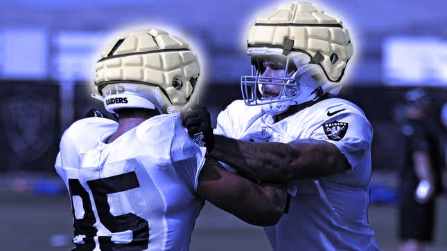 Two Las Vegas Raiders players wearing Guardian Caps during practice