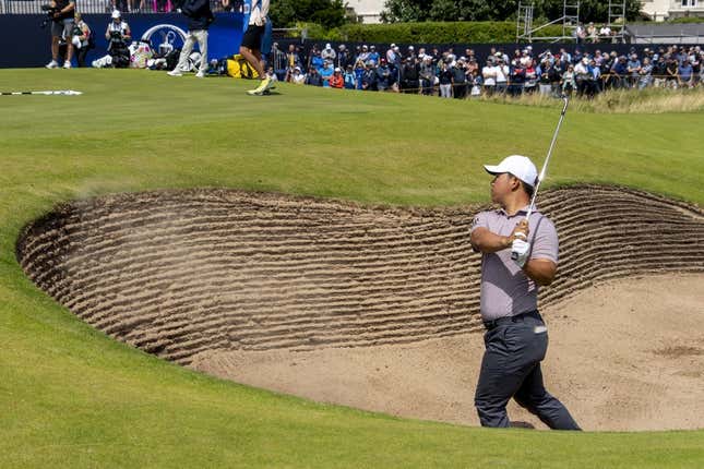 July 19, 2023; Hoylake, ENGLAND, GBR; Tom Kim hits out of the bunker on the 17th hole during a practice round of The Open Championship golf tournament at Royal Liverpool.