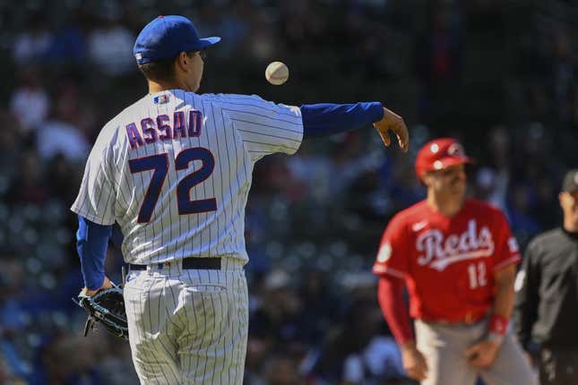 May 26, 2023; Chicago, Illinois, USA; Chicago Cubs starting pitcher Javier Assad (72) bumps the ball during the ninth inning against the Cincinnati Reds at Wrigley Field.