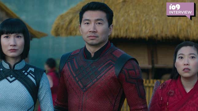 Meng’er Zhang, Simu Liu, and Awkwafina are all staring in the same direction while standing side by side  Shang-Chi and the Legend of the Ten Rings.