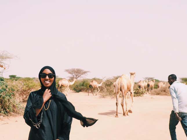 Hamda Yusuf with the camels in Hargeisa, Somaliland.