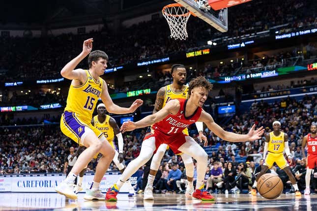 Mar 14, 2023; New Orleans, Louisiana, USA; New Orleans Pelicans guard Dyson Daniels (11) looses the ball out of bounds against Los Angeles Lakers guard Austin Reaves (15) during the first half at Smoothie King Center.