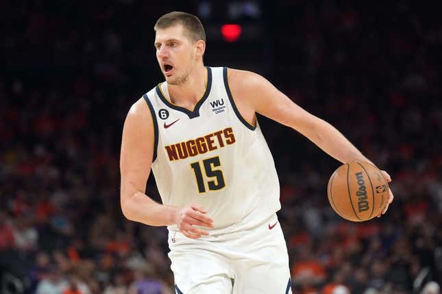 May 11, 2023; Phoenix, Arizona, USA; Denver Nuggets center Nikola Jokic (15) dribbles against the Phoenix Suns during the second half of game six of the 2023 NBA playoffs at Footprint Center.