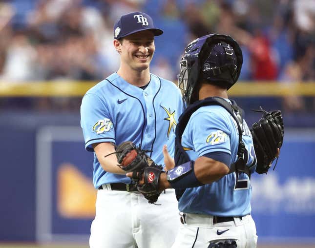 Apr 8, 2023; St. Petersburg, Florida, USA; Tampa Bay Rays relief pitcher Kevin Kelly (49) and catcher Francisco Mejia (21) celebrate after they defeated the Oakland Athletics at Tropicana Field.